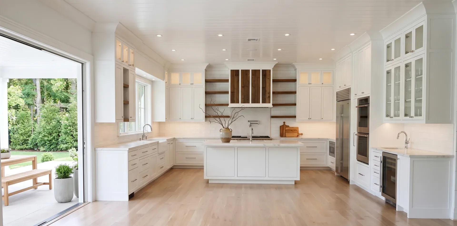 Bright white kitchen with light oak hardwood floors finished by Good Ol' Boy Hardwood Floors in Kansas City